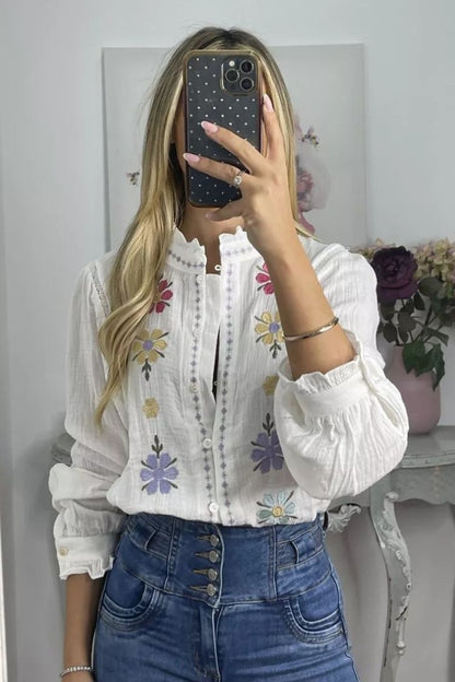 White shirt with colorful embroidered flowers